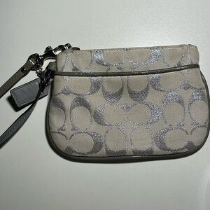 Coach cream and silver wristlet